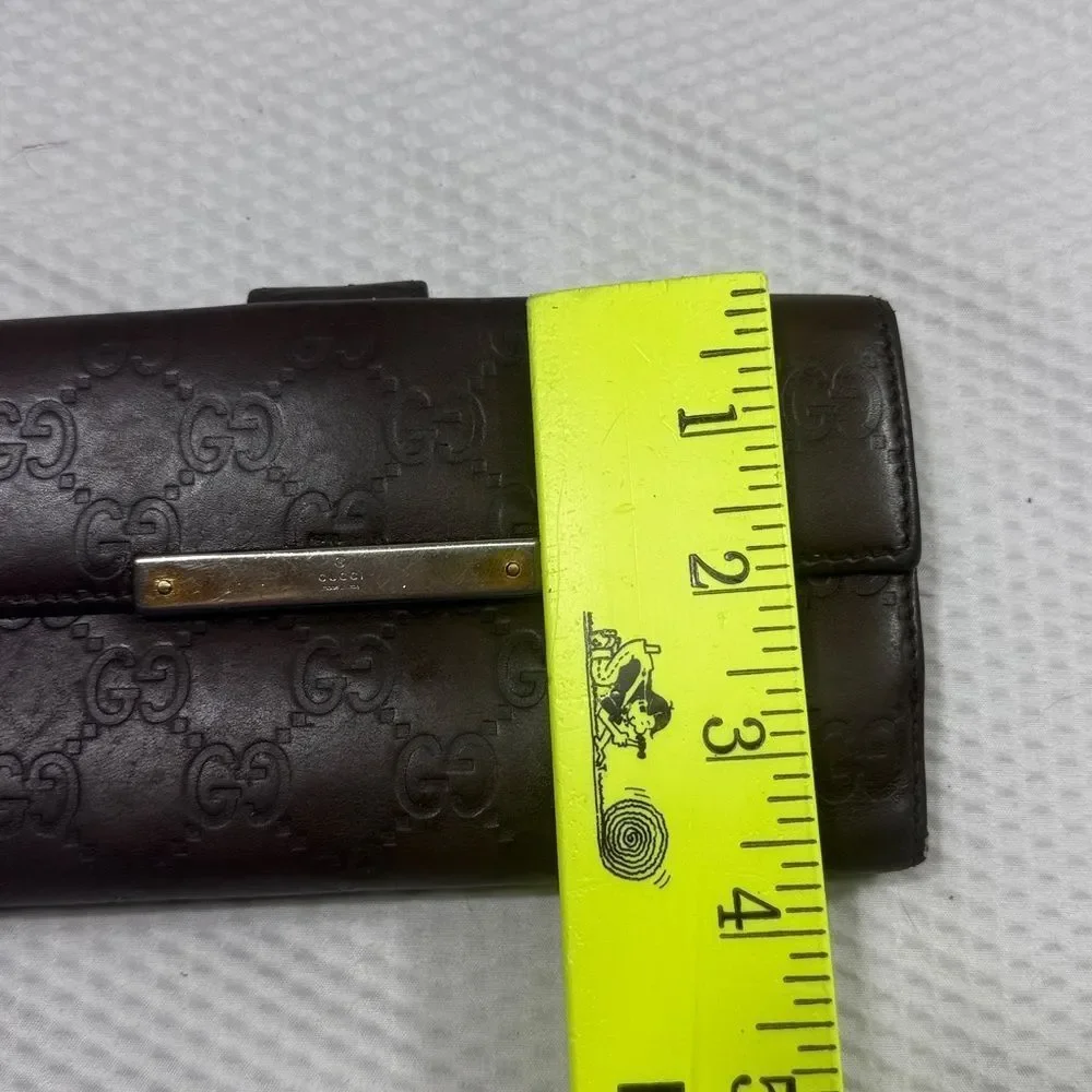 Gucci Dark Brown Embossed Clutch wallet inside is clean. GUC much life left!